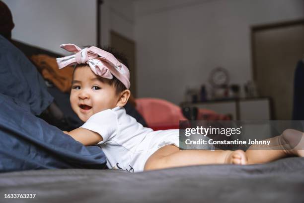 baby wearing pampers on head